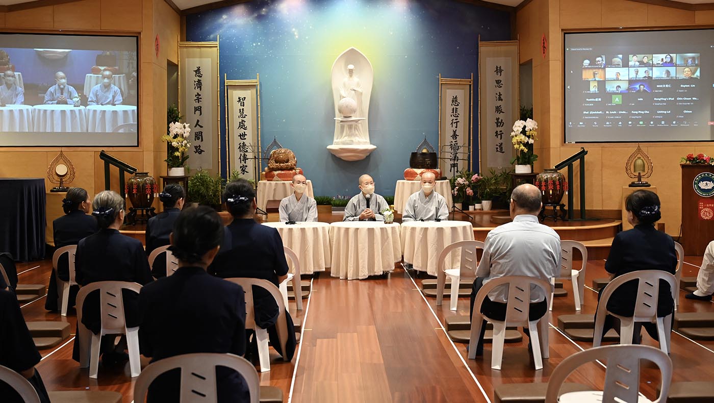Dharma Masters Shih De Cheng (left), Shih De Yuan (middle), and Shih De Huang (right) address the Tzu Chi congregation.