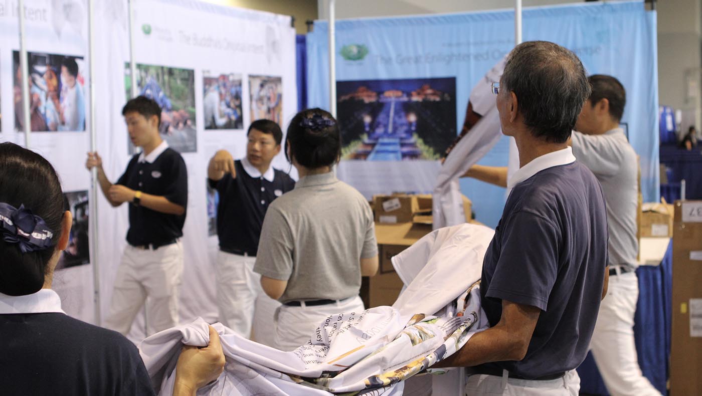Tzu Chi teams join hands to prepare displays for informative booths covering varied subjects.