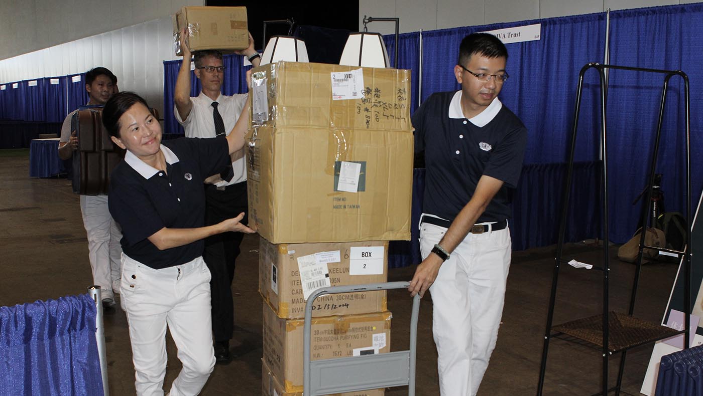 Tzu Chi teams join hands to prepare displays for informative booths covering varied subjects.