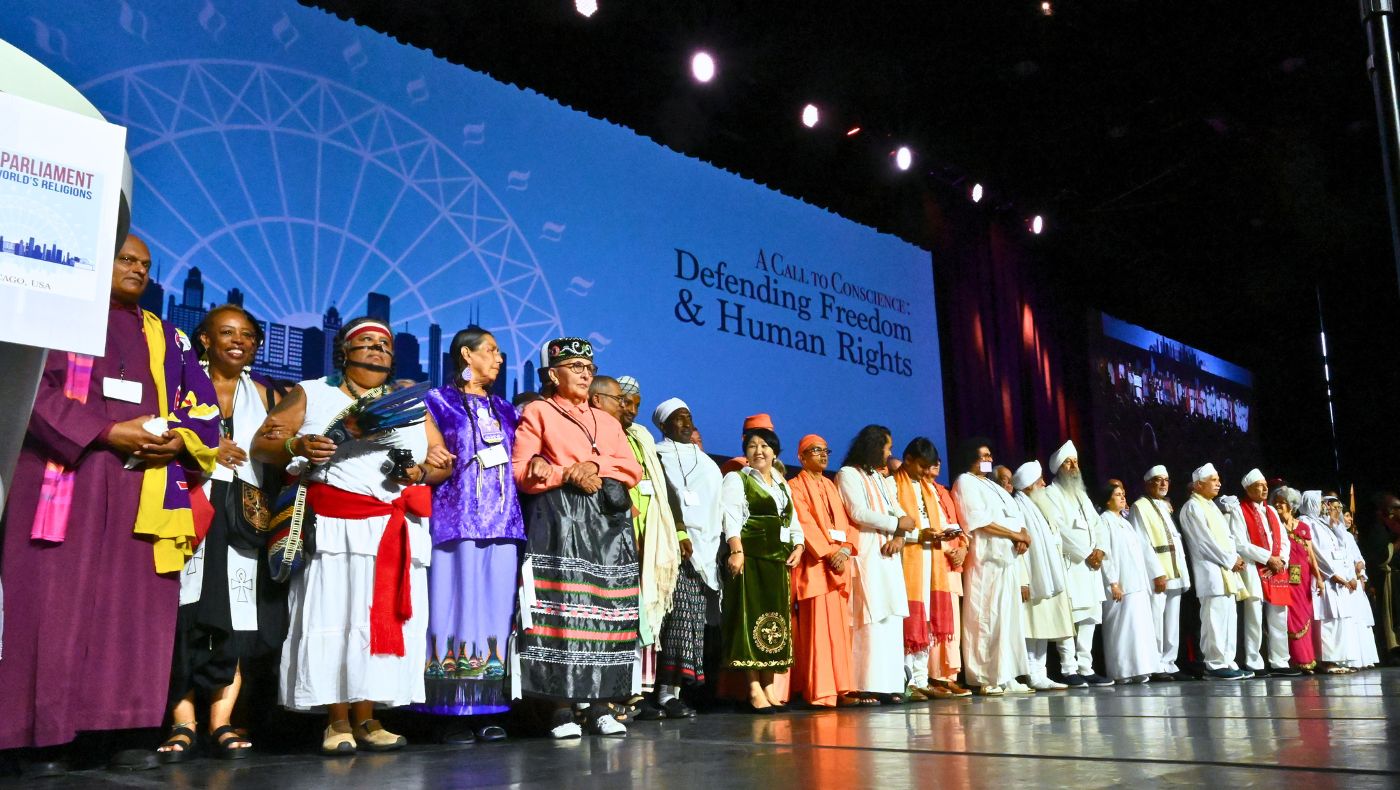People from different religions group photo on the stage