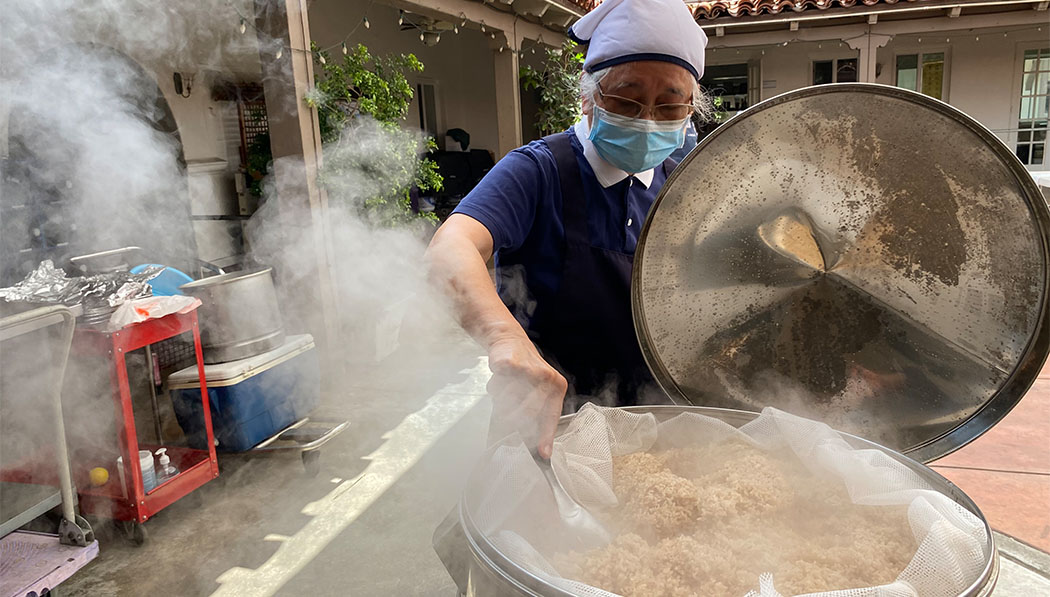 Tzu Chi volunteer steaming rice dumplings