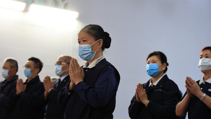 Tzu Chi volunteers praying