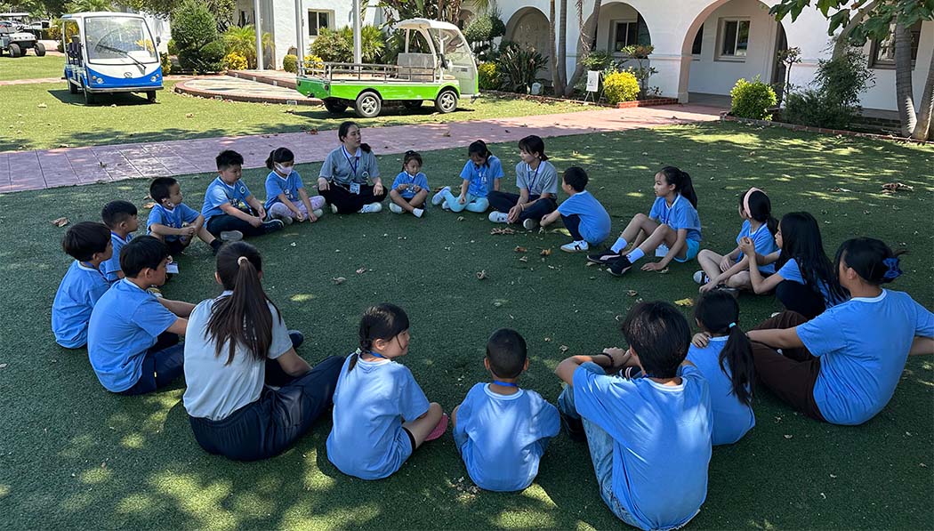 Tzu Chi academy students sitting in the school campus
