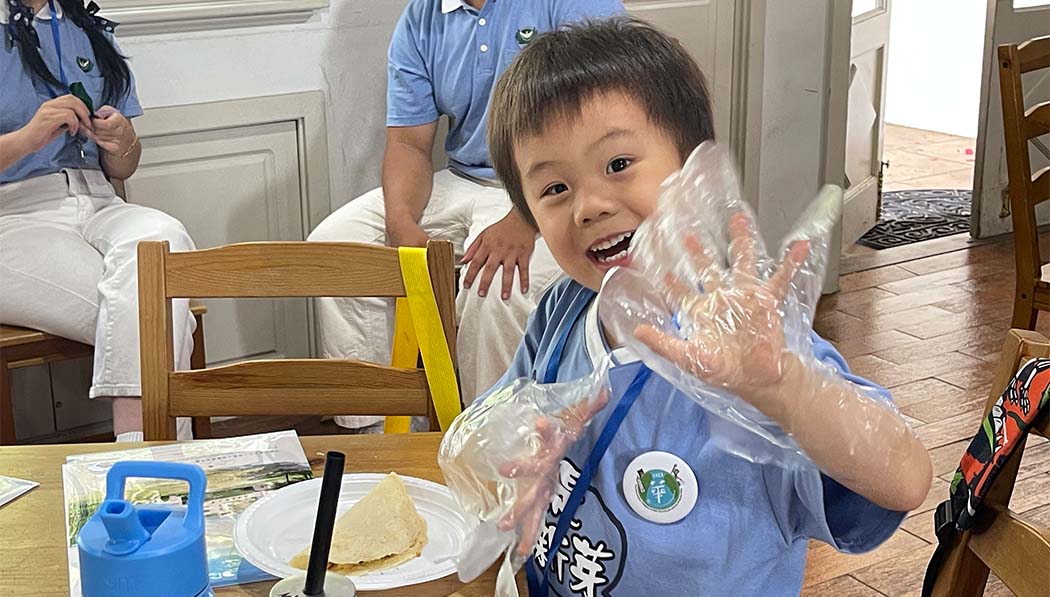 Tzu Chi academy student showing his happy face