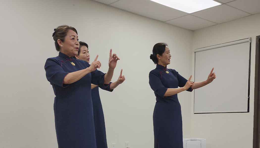 Volunteers performing sign language