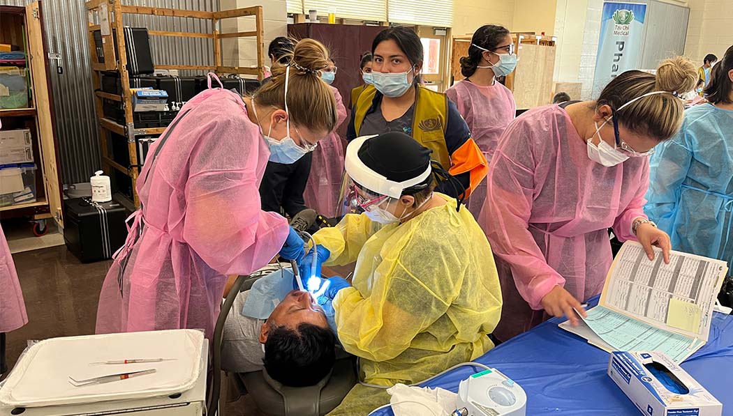 Tzu Chi medical volunteers giving treatment