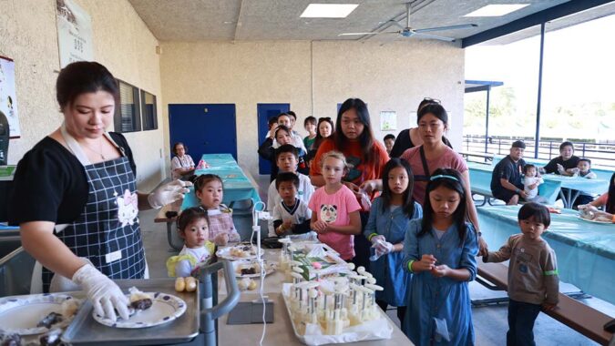 Tzu Chi Walnut Elementary student and parents making traditional Mid-autumn festival food