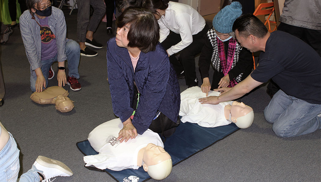 Visitors practicing CPR
