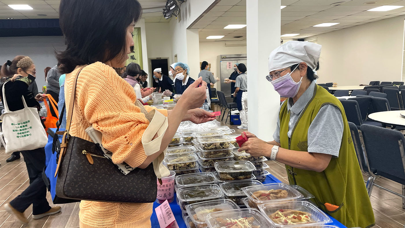 Visitor purchasing vegetarian food