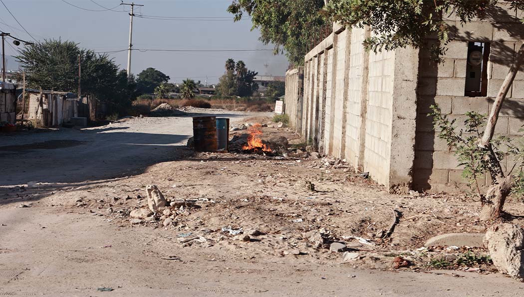 Trash burning at the corner in Tijuana
