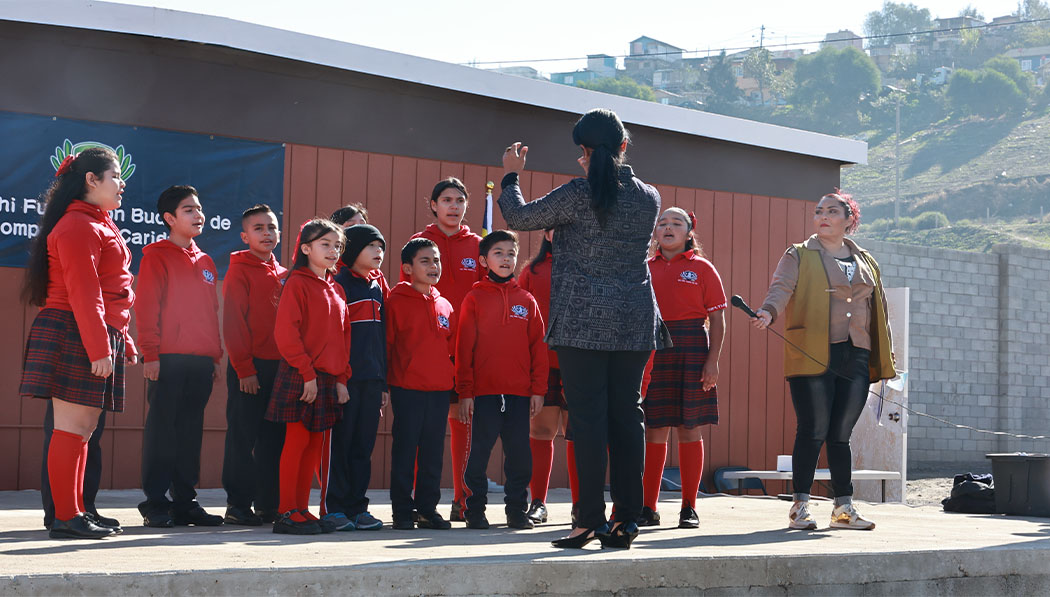 Teachers and students of Tijuana Tzu Chi Elementary School perform on stage