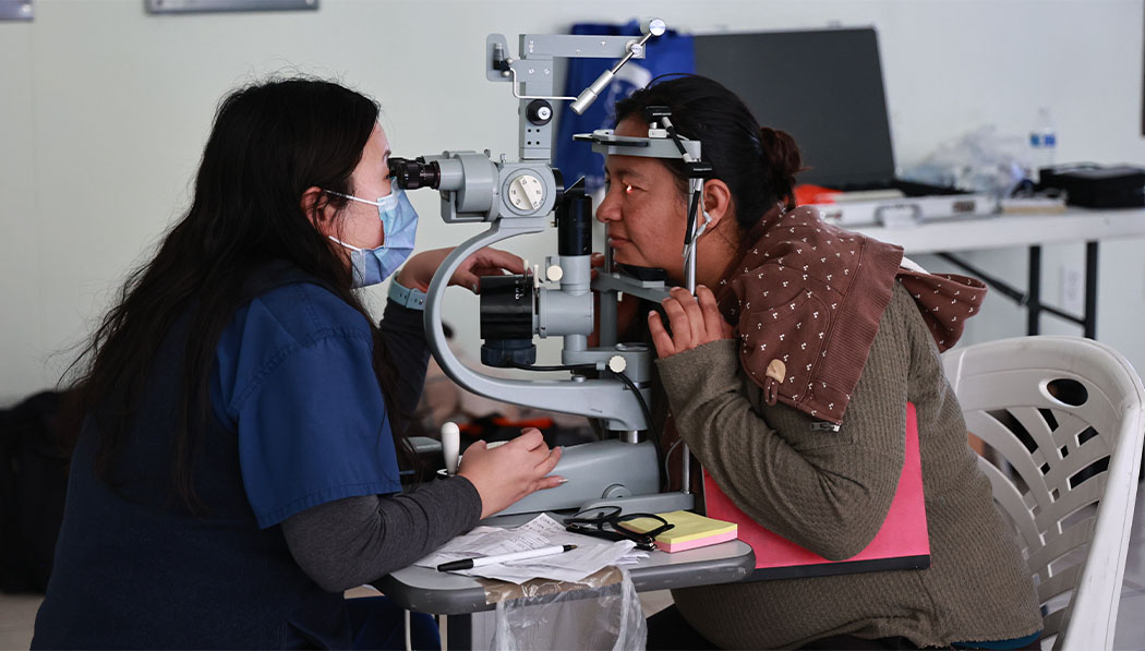 Ophthalmologist is examining a patient