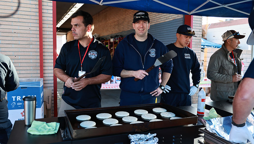Fire fighters Prepare delicious breakfast for visiting families