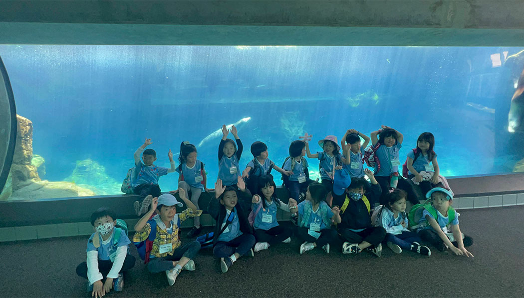 The campers pose for a group shot in front of the educational site's giant aquarium. Photo/Michelle Young