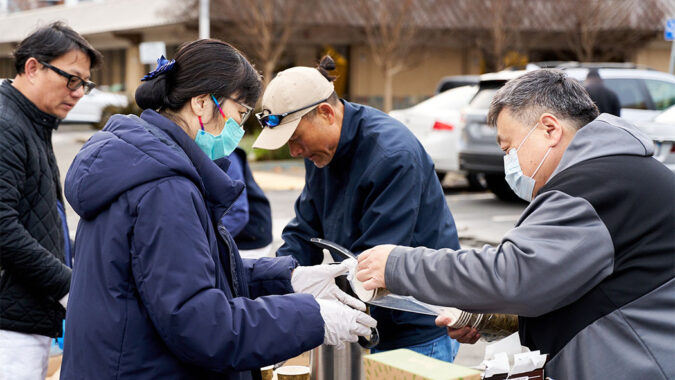 Volunteers help pack coffee and hot soup