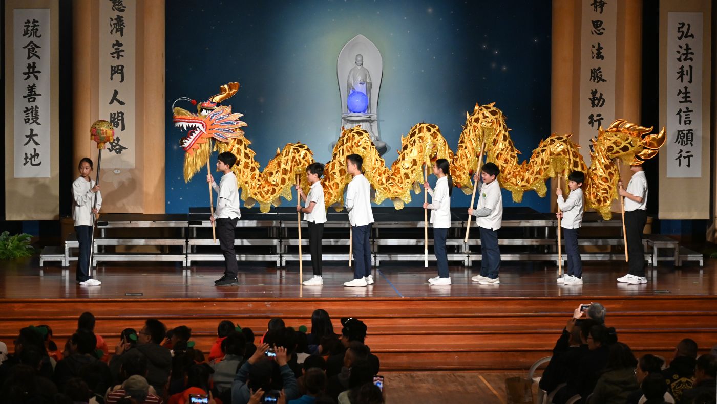Students perform dragon dance to welcome the Year of the Dragon.