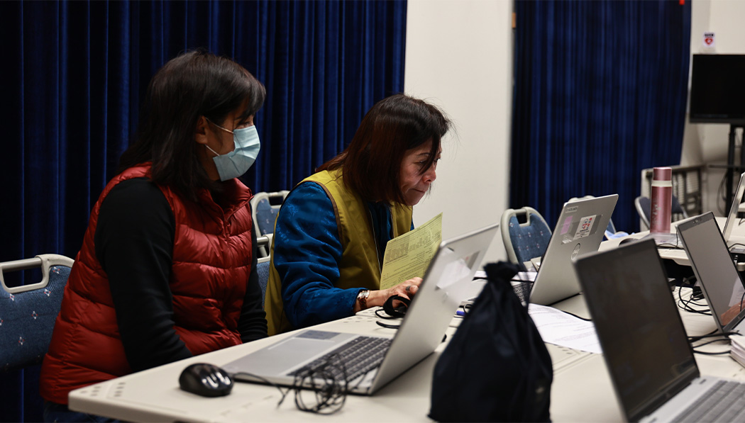 Tzu Chi volunteers carefully input people’s tax return information into the computer