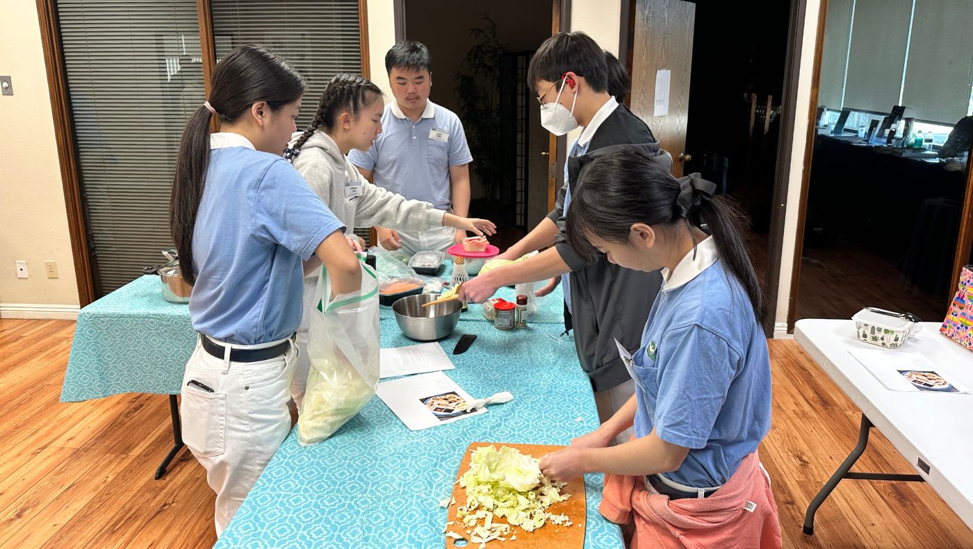 The Tzu-young men were busy chopping vegetables.