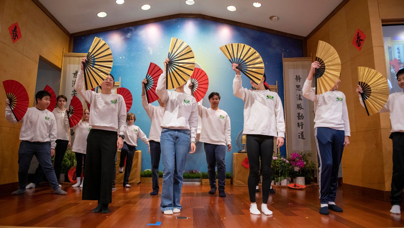 Children perform kung fu fan