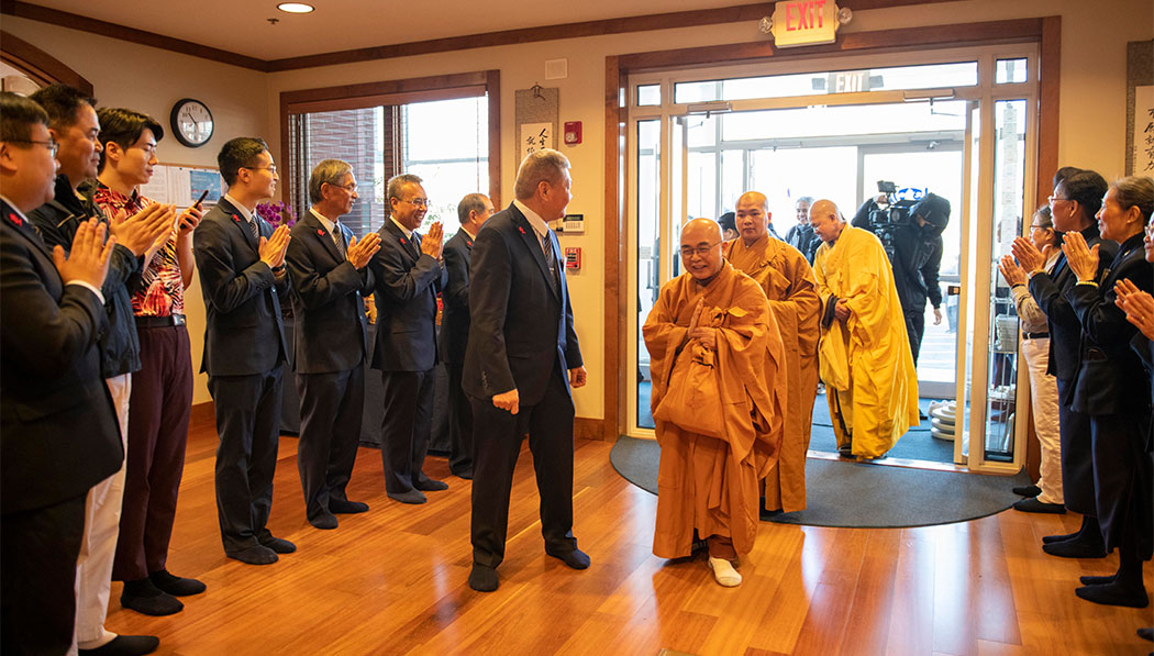 Masters walking into Tzu Chi USA Midwest Region office