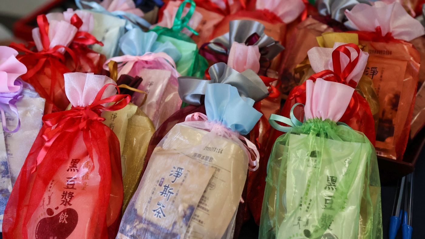 Lucky bags full of New Year flavor are neatly placed on the long table.