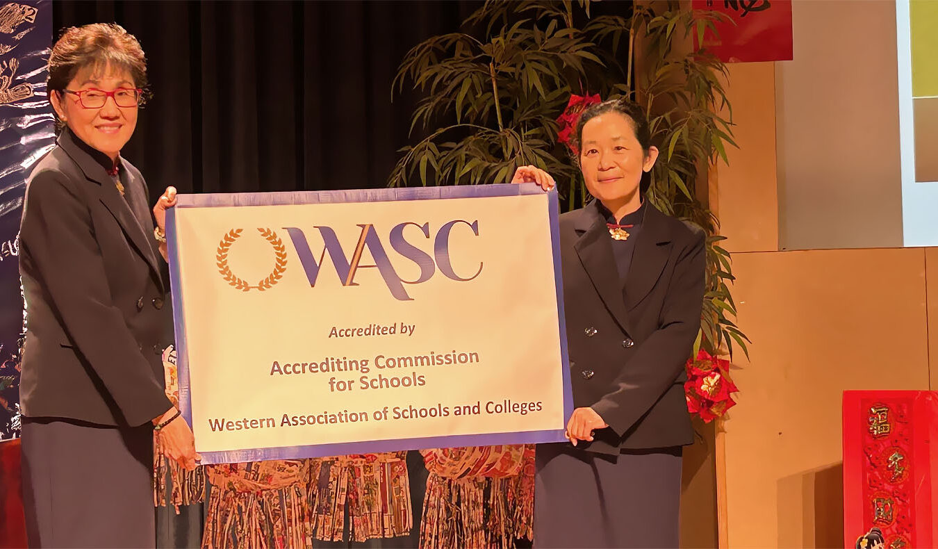 2 Tzu Chi staffs holding ACS WASC certificate