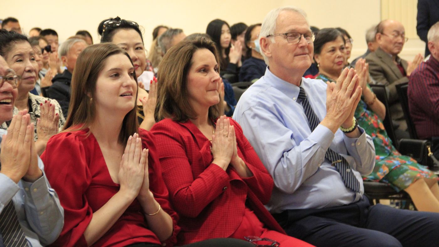 Moran, director of the Central Florida District of the American Red Cross, attends sign language activities intently.