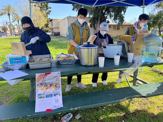 Volunteers distributing hot meal
