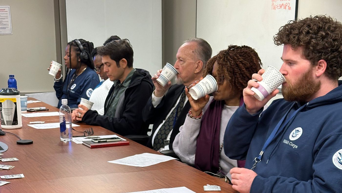 Employees engaged in emergency relief work at FEMA focus on sipping meditation tea.