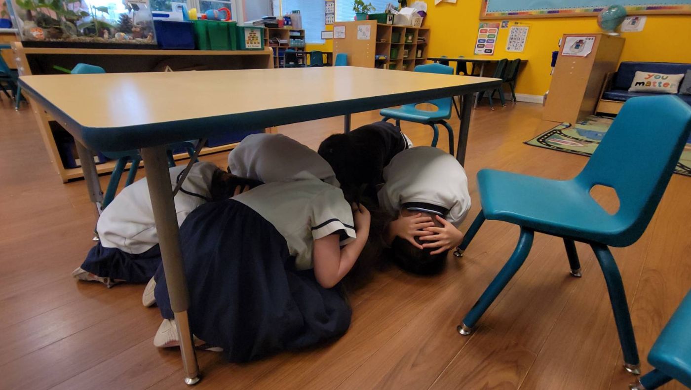The children practiced how to act and protect themselves when an earthquake strikes.