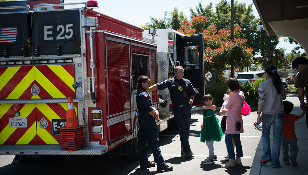 The San Jose Fire Department provides fire trucks to the scene to directly interact with the community and share disaster prevention knowledge.