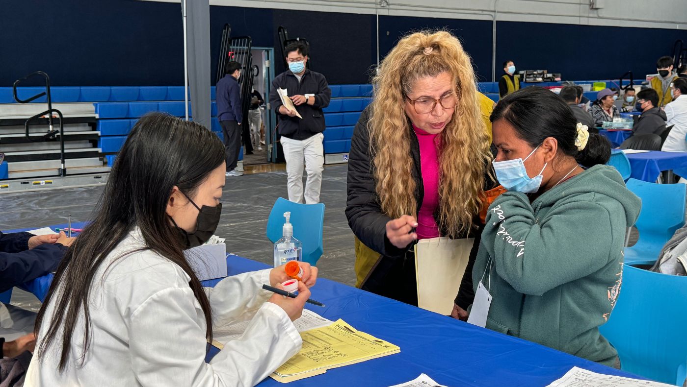 Davis Elementary School staff member Martha Patalup volunteers as a translator to help patients communicate with doctors.