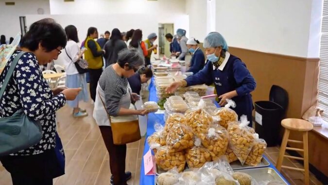 Congregants lined up to buy Taiwanese vegetarian snacks carefully prepared by Dallas volunteers to donate to hurricane victims