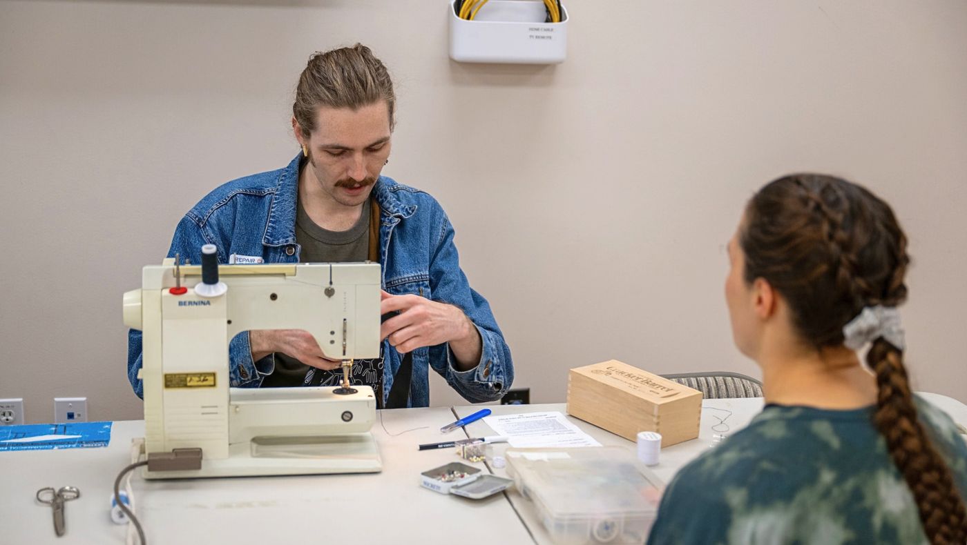 Tyler, a sewing volunteer, began her journey with sewing in her childhood. (Photography by Jiang Guoan)