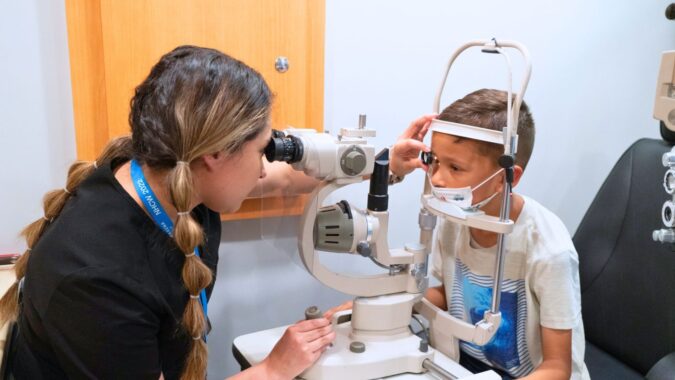 Tzu Chi medical volunteers check a child’s eyesight.