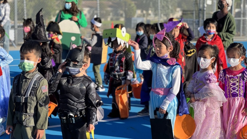 Children dressed up in Halloween costumes, as if entering an enchanted world. Photo/ Lili Lin