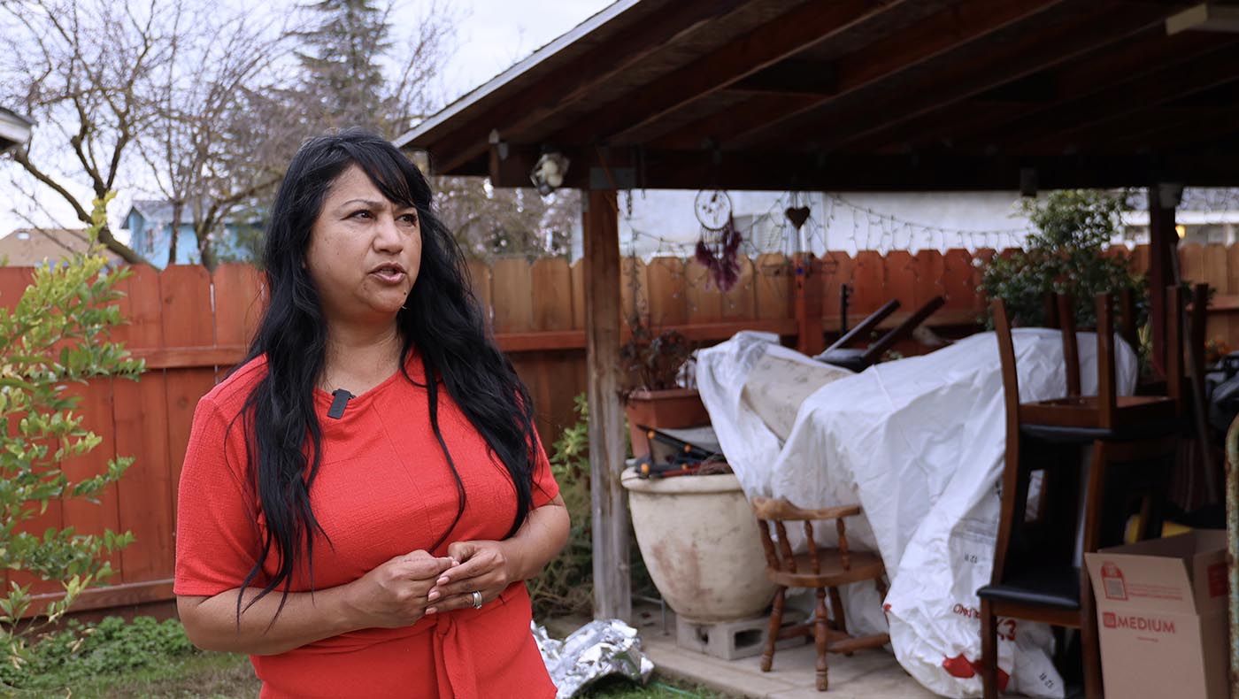 Fabi Cervantes shares her story in front of her mother’s home, which sustained severe damage along with her own. Photo/Kitty Lu