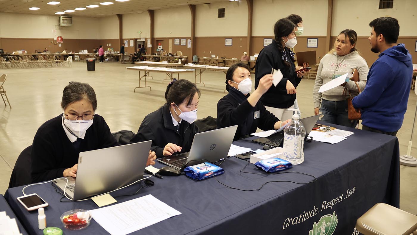 Tzu Chi volunteers review registrations, preparing to serve storm survivors who will arrive shortly. Photo/Kitty Lu
