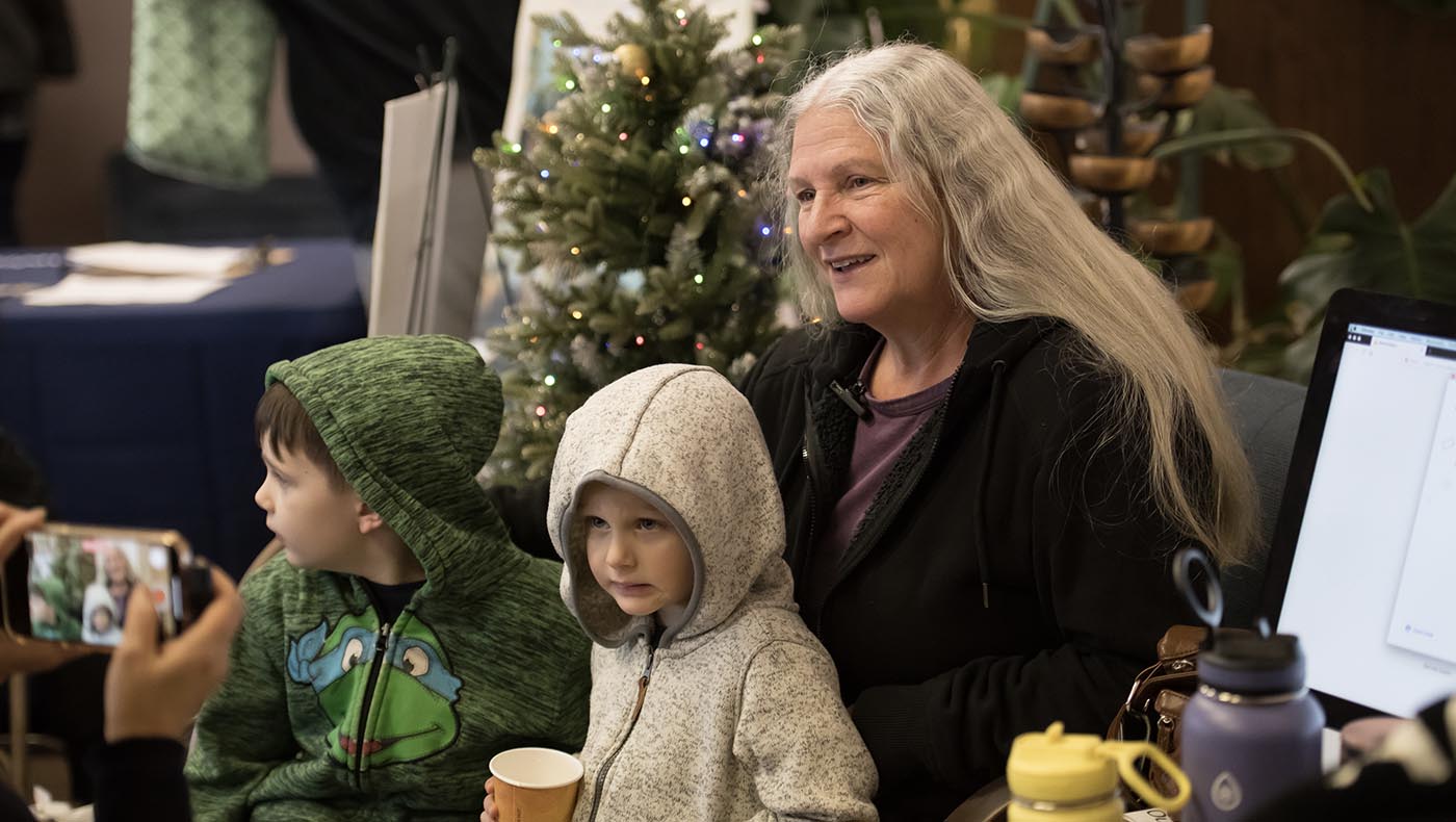 Patti Tucker attends the holiday celebration with her grandchildren. Photo/Min Yung Cheung
