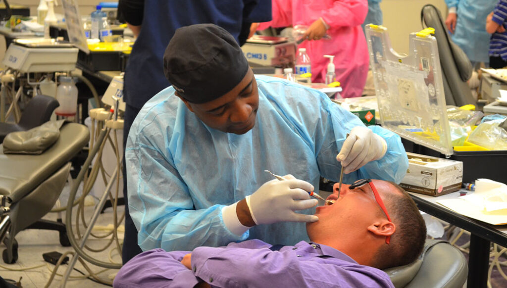 Tzu Chi volunteer dentist giving dental treatment