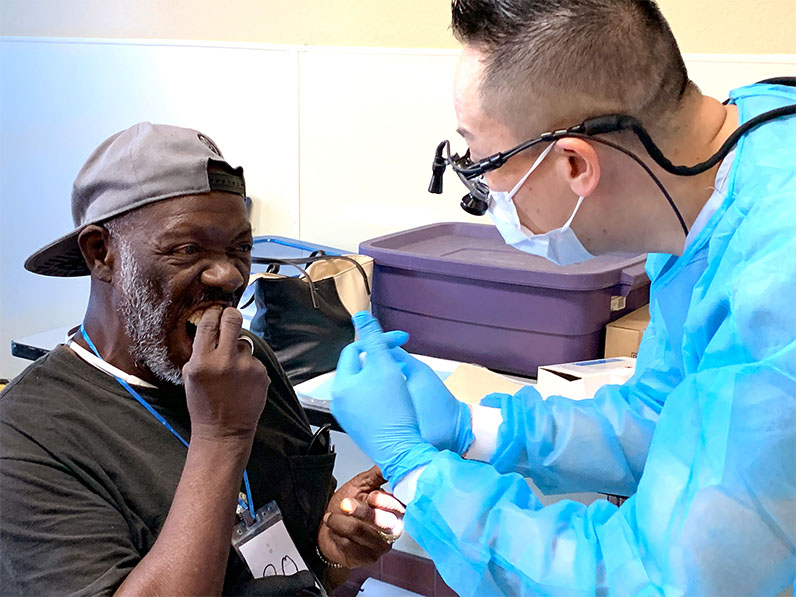 Tzu Chi volunteer dentist giving dental treatment