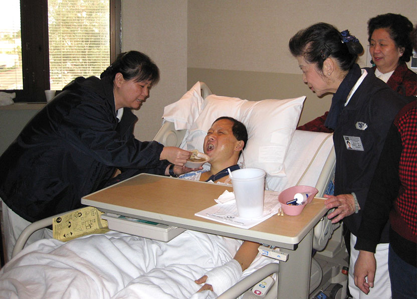Tzu Chi volunteers taking care of the car accident patient