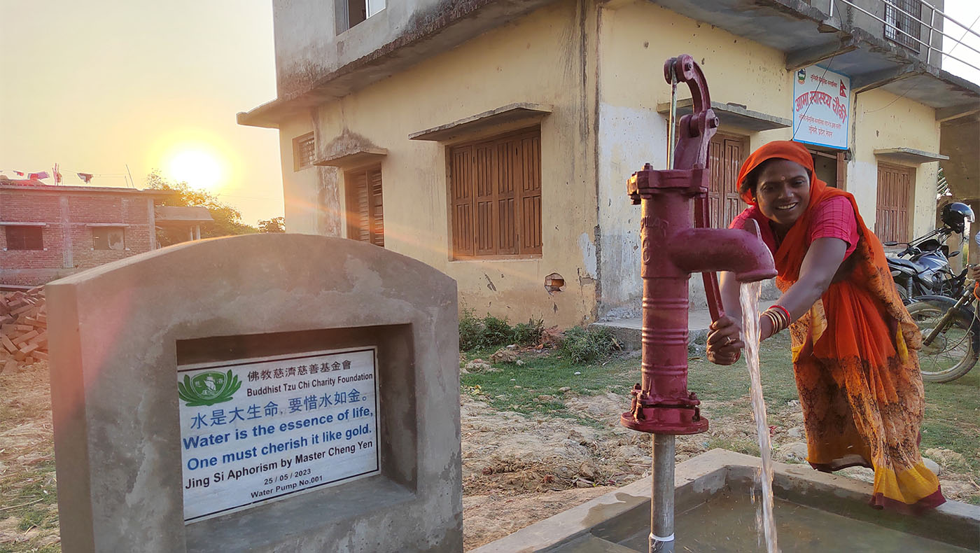 Neighbor bumping water from Aama Health Post,Lumbini, Nepal's well