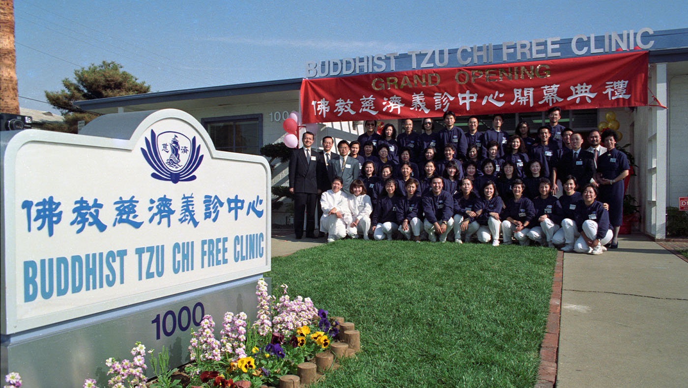 Tzu Chi volunteers group photo in front of Buddhist Tzu Chi Free Clinic