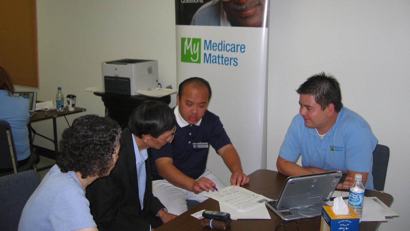 Dr. Eric Yun (second right) translates for people aged 65 and above