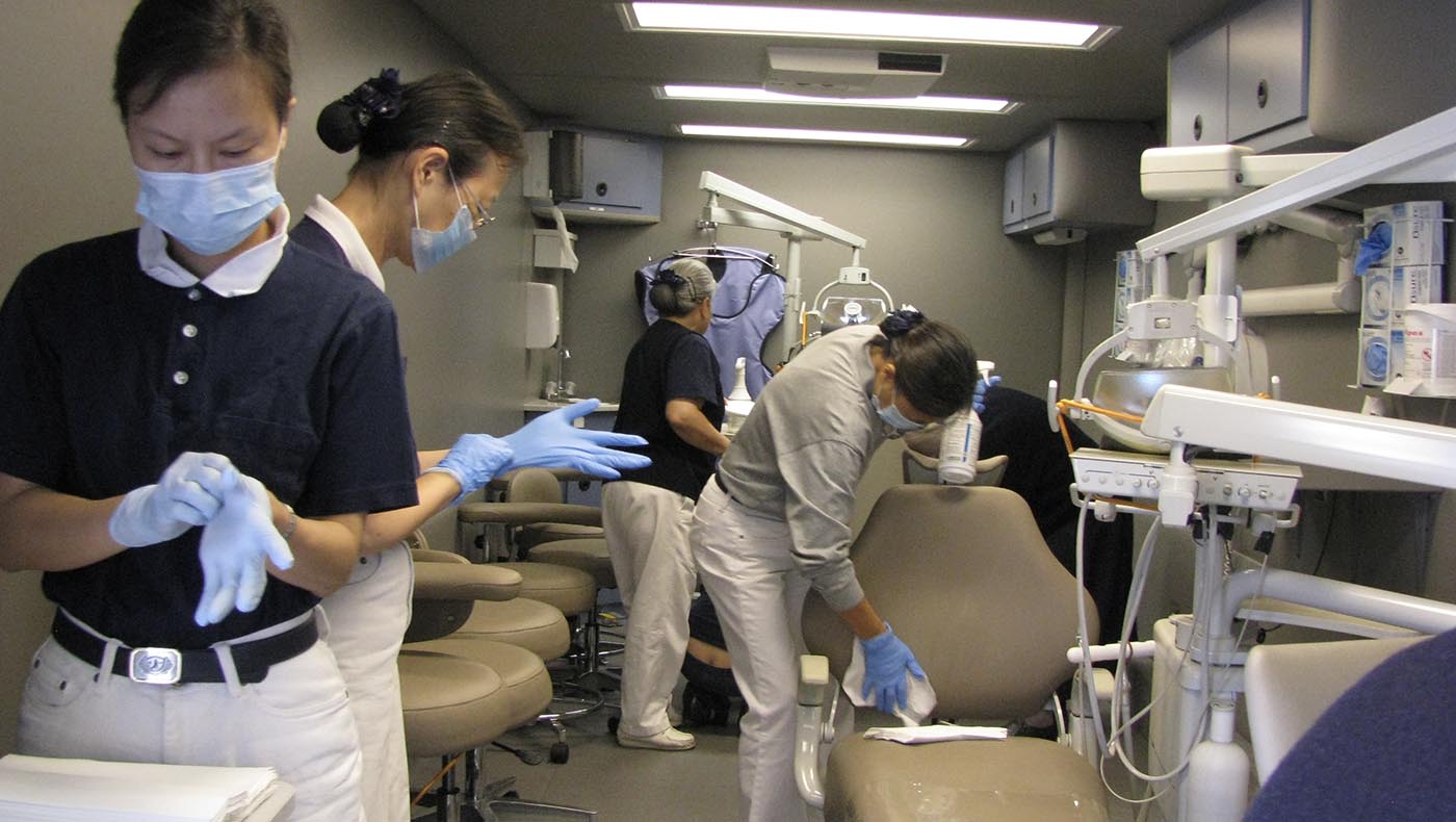 The Tzu Chi Dental Mobile Clinic provides free dental care services in Van Nuys, Los Angeles, California in 2002.