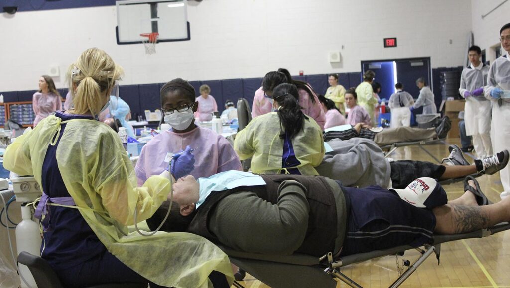 Dentists treat patients at a free clinic on April 29, 2017.