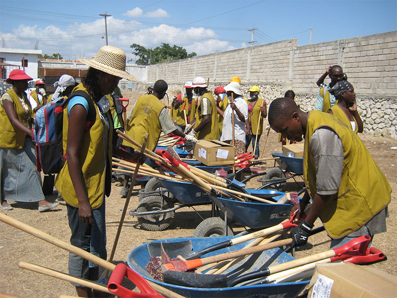 Local residents take cleaning tools and prepare to clean their homes