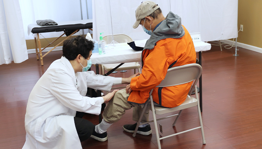 Eric Lin checks symptoms and treat patients