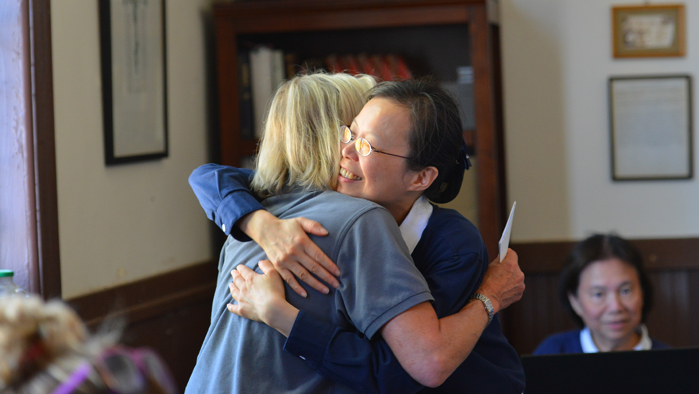 Chiung-Huei Liu gives warm hugs to the Valley Fire survivor